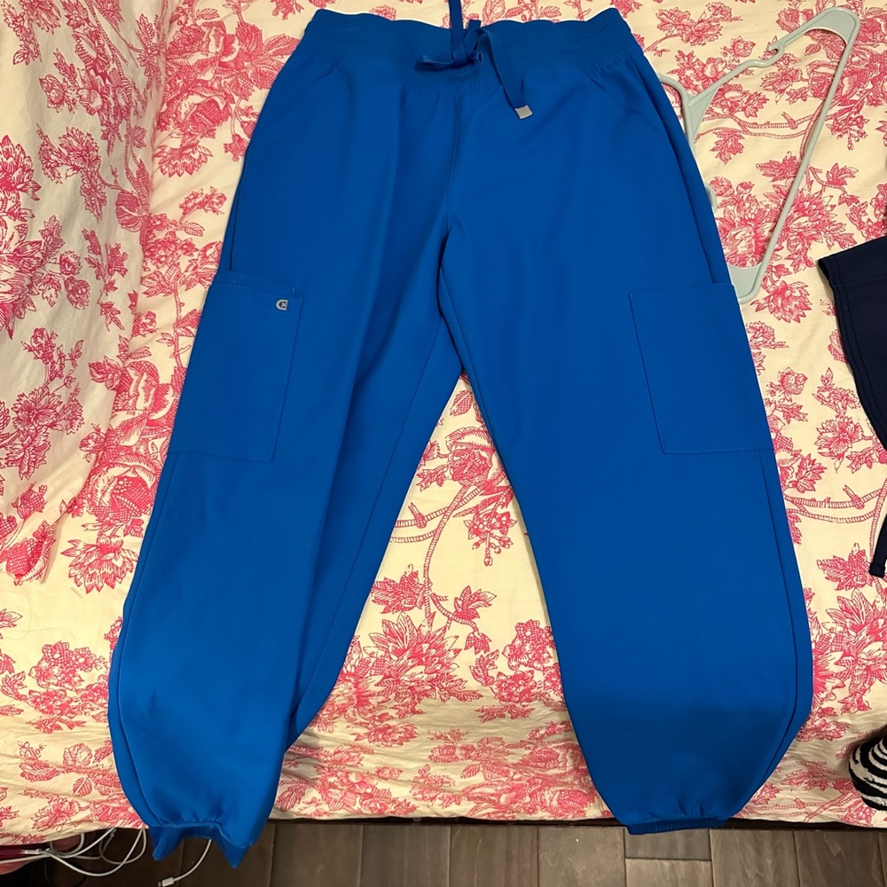 Koi cureology blue royal scrubs! Size small in both top and bottom.